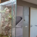 biophilic glass panel installation in interior space